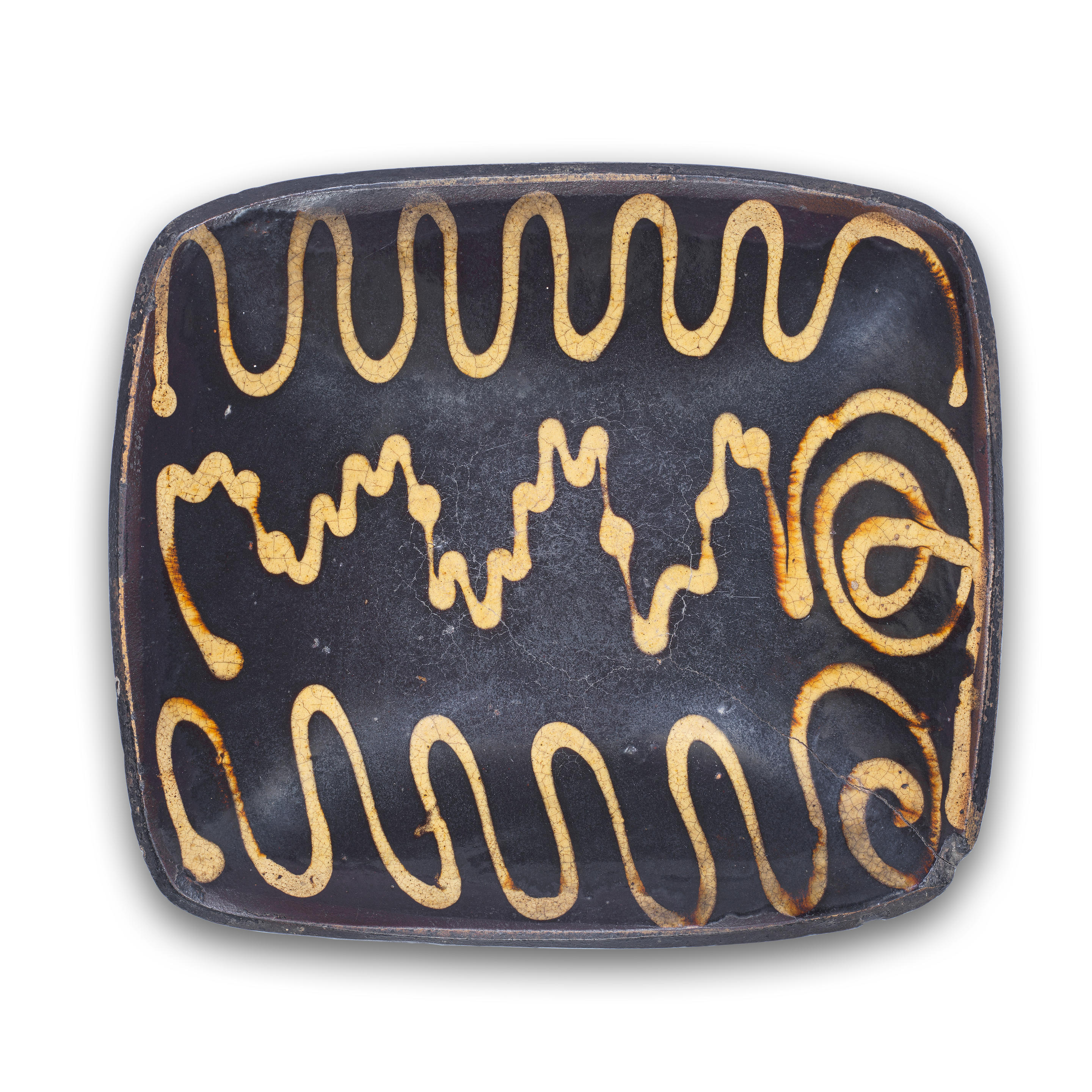 AN ENGLISH SLIPWARE DISH 18TH CENTURY Midlands or northern England