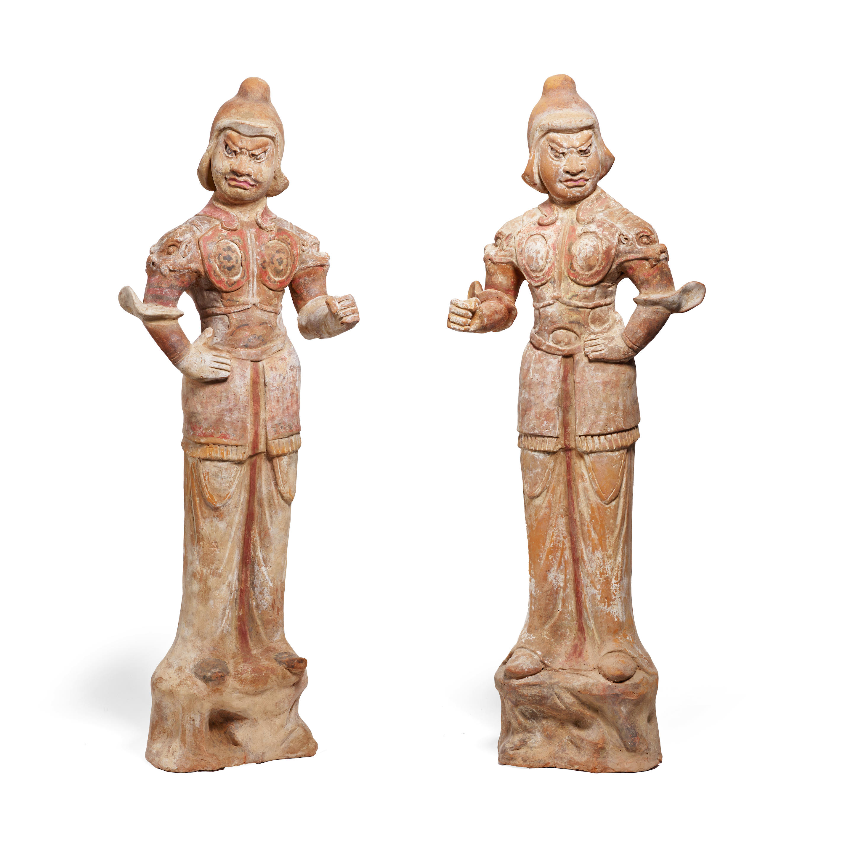 A PAIR OF LARGE PAINTED POTTERY FIGURES OF GUARDIANS Tang