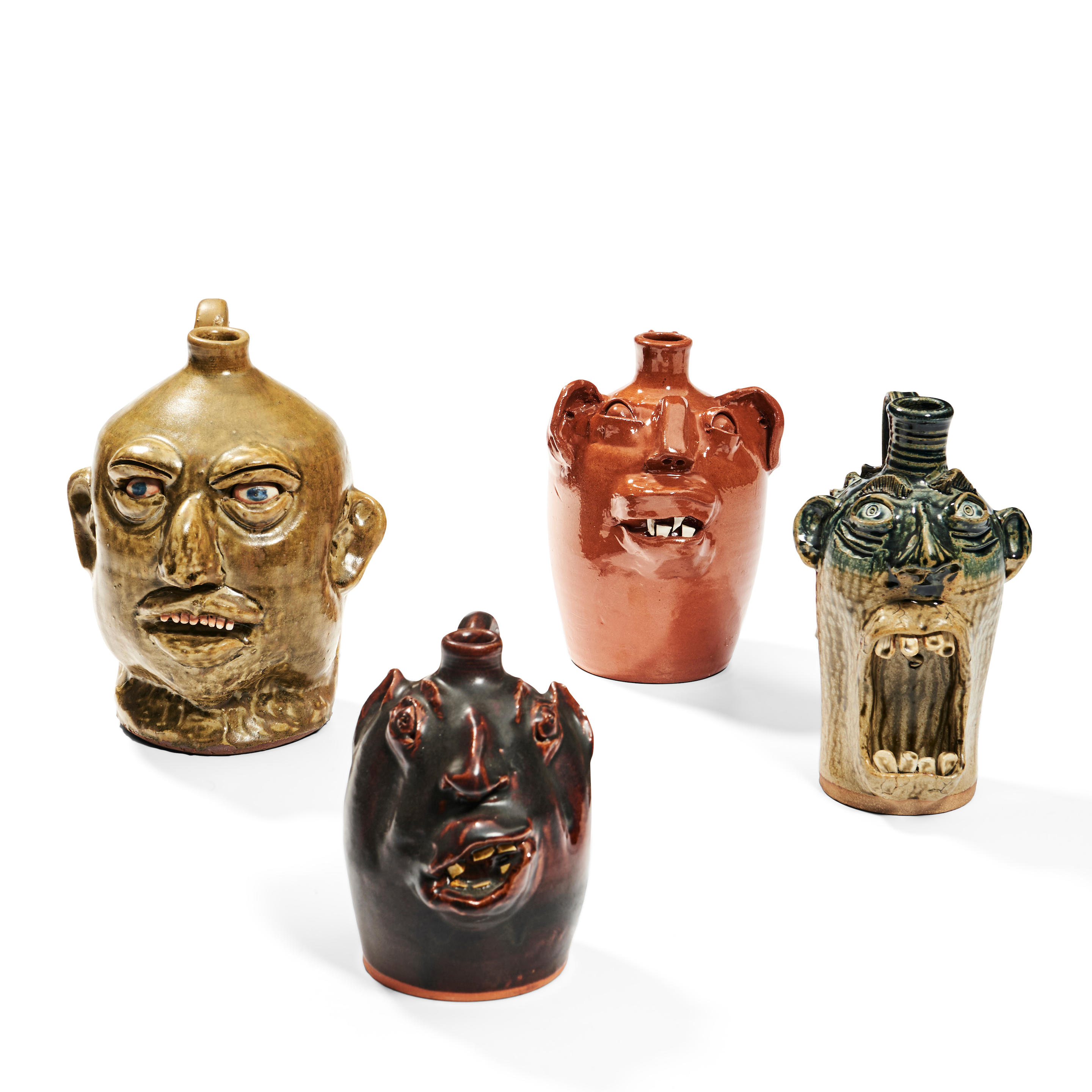 FOUR CERAMIC FACE JUGS North Carolina contemporary Jeff McDowell jug