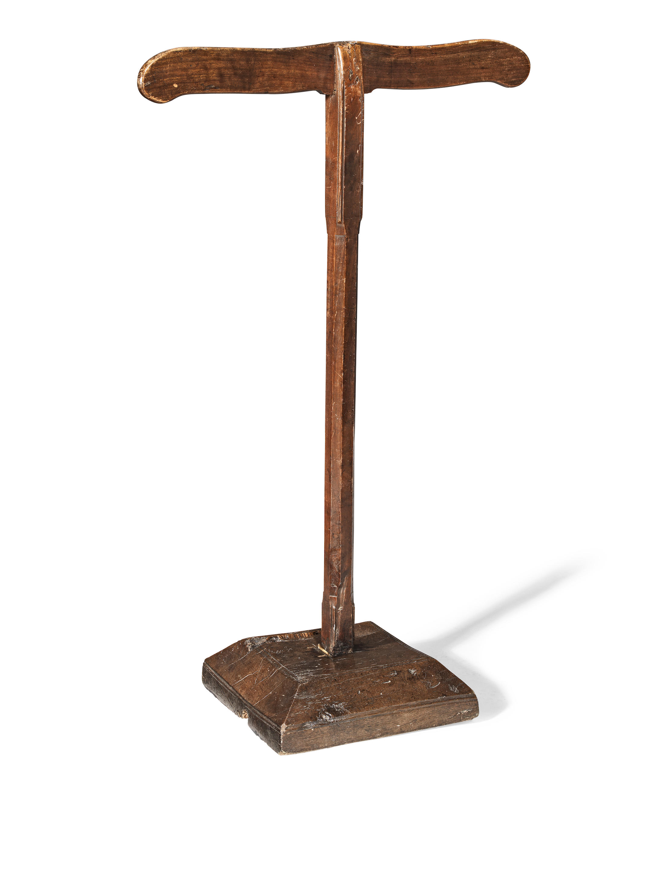 A 17TH CENTURY WALNUT VESTMENT STAND The undulating top rail