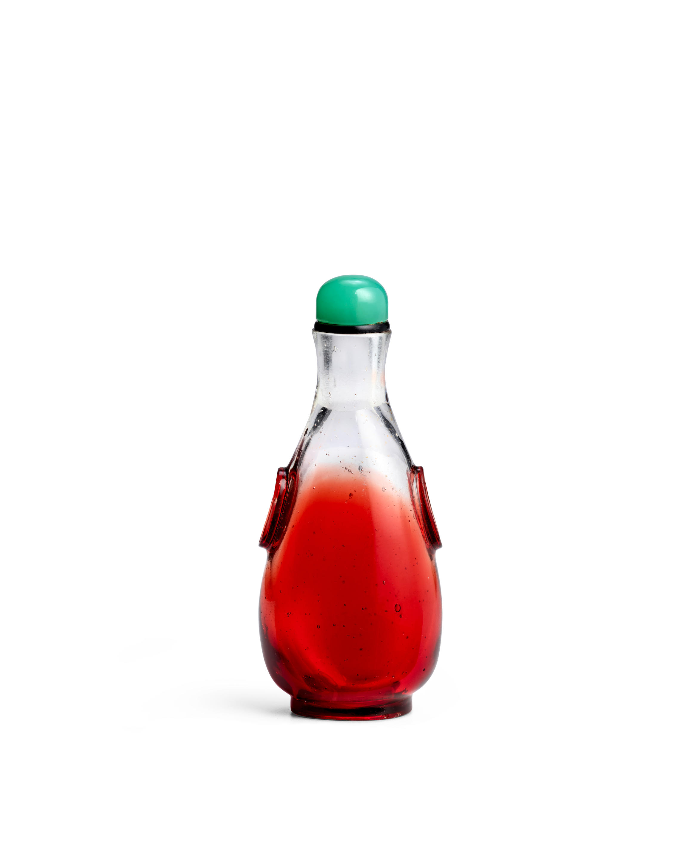 A MINIATURE PEAR SHAPED TRANSPARENT RED OVERLAY CLEAR GLASS BOTTLE