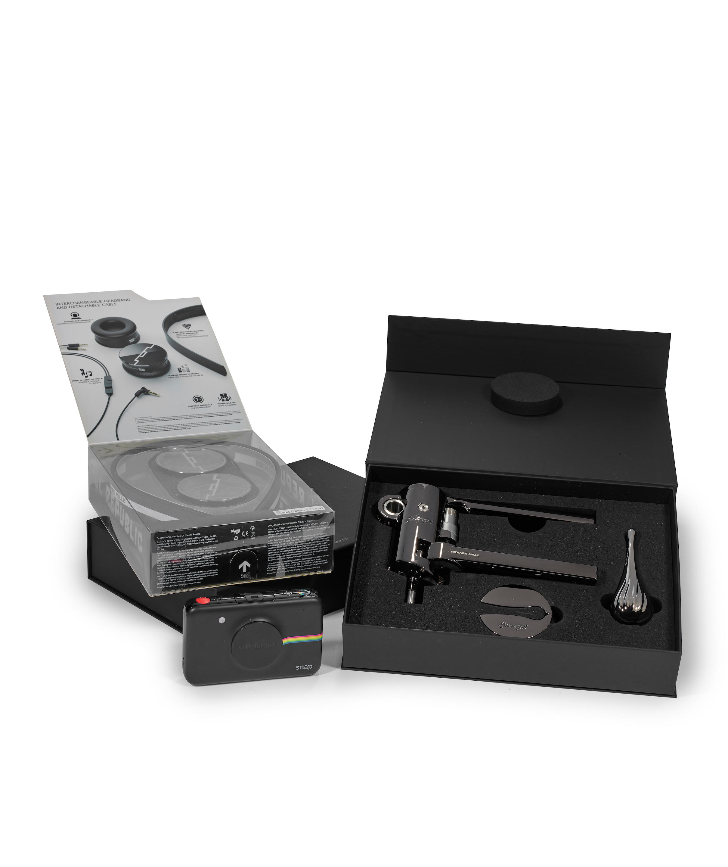RICHARD MILLE A GROUP LOT OF A POLAROID CAMERA A