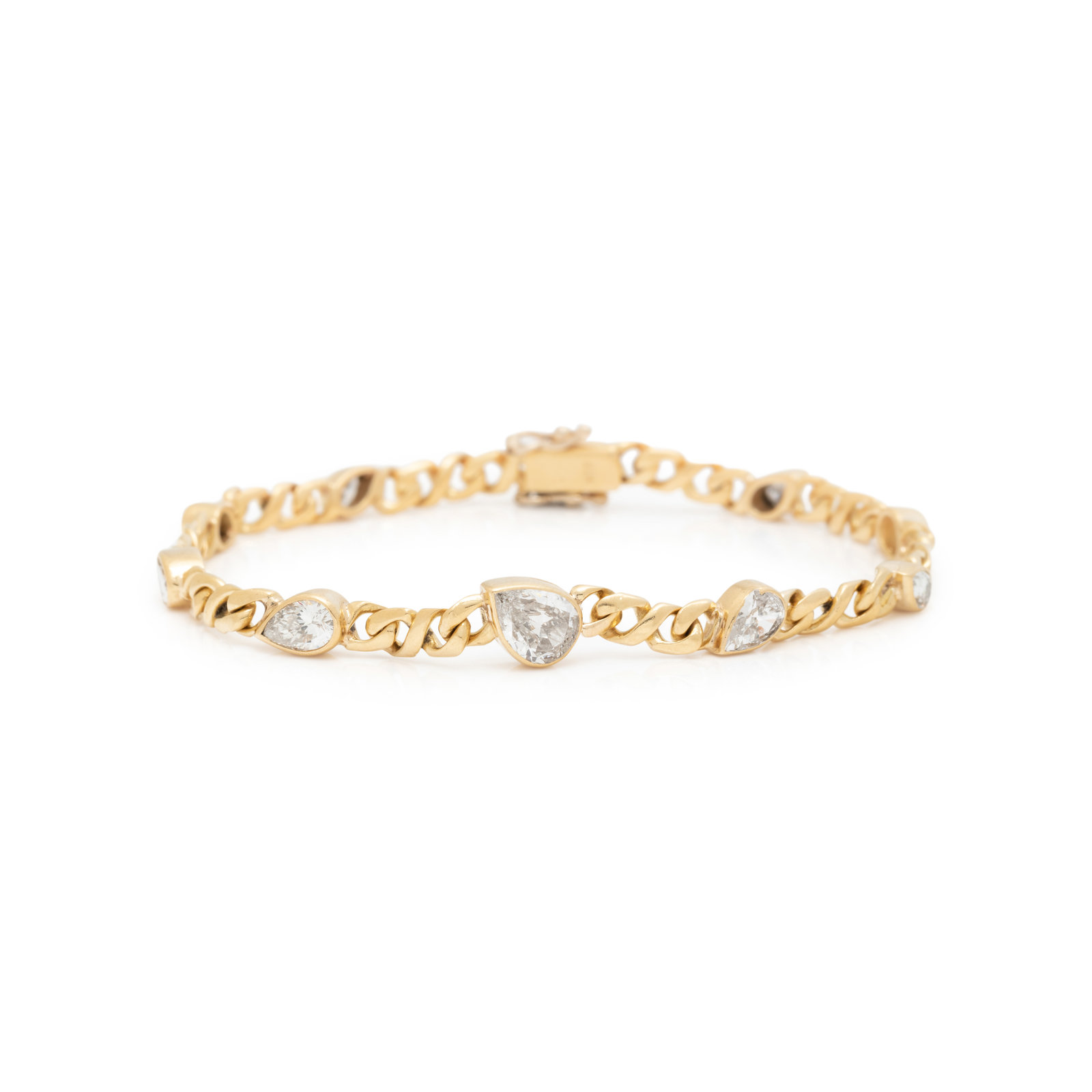 YELLOW GOLD AND DIAMOND BRACELET Consisting of a fancy curb