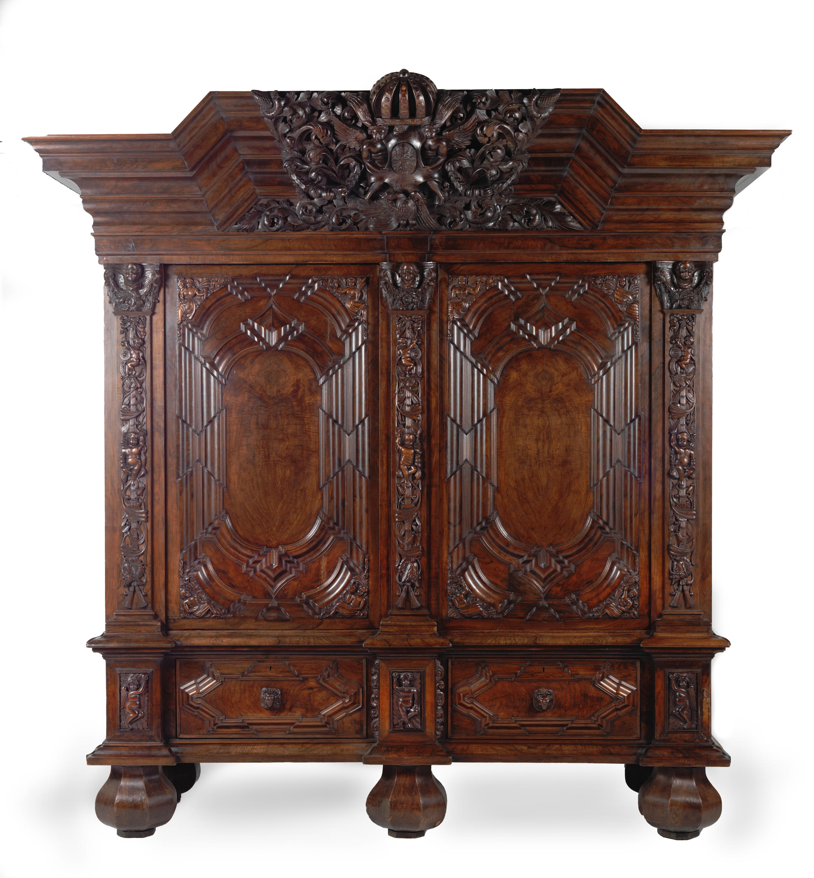 A LARGE GERMAN WALNUT SCHRANK OR WARDROBE Early 18th century