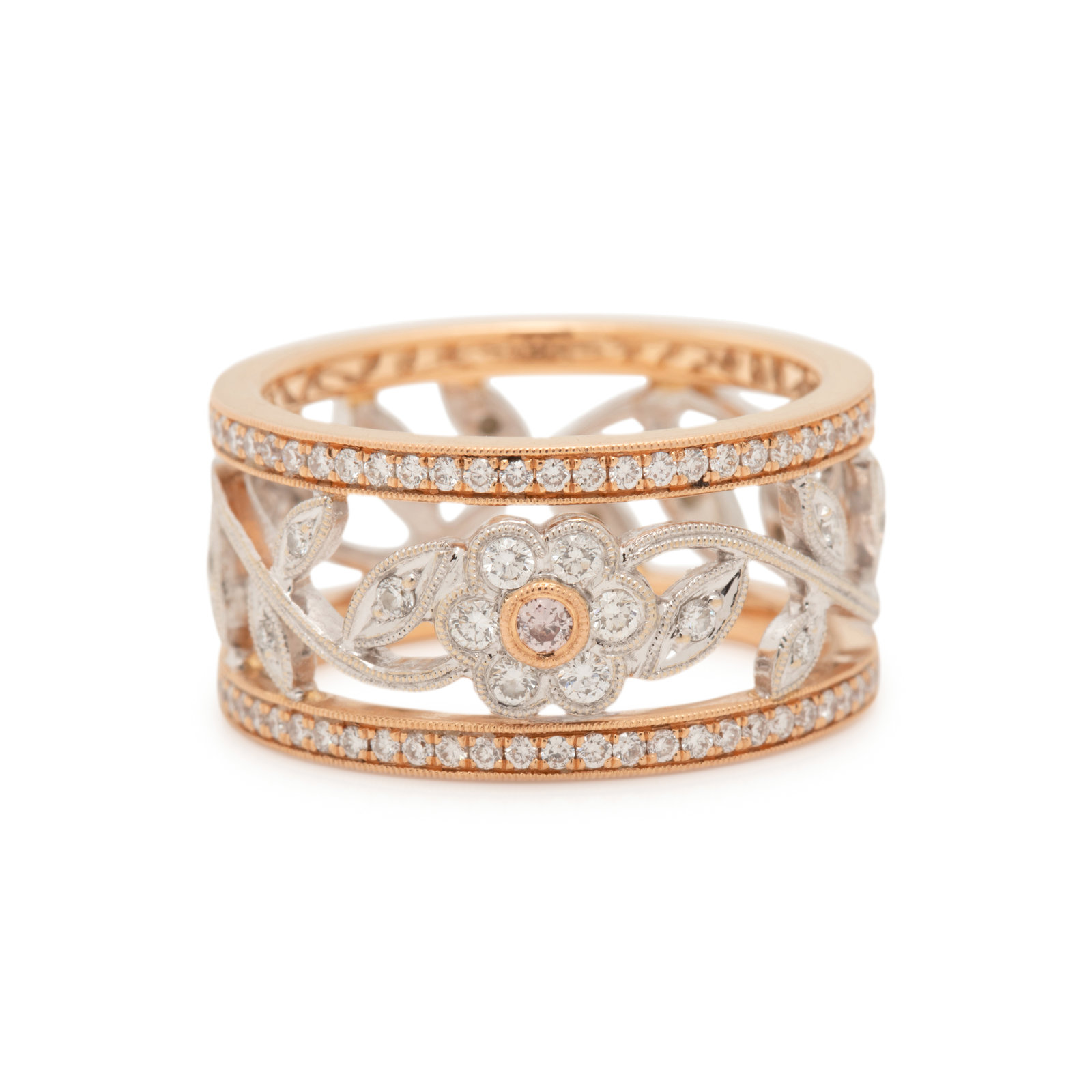 DIAMOND AND COLORED DIAMOND RING Containing numerous round brilliant cut
