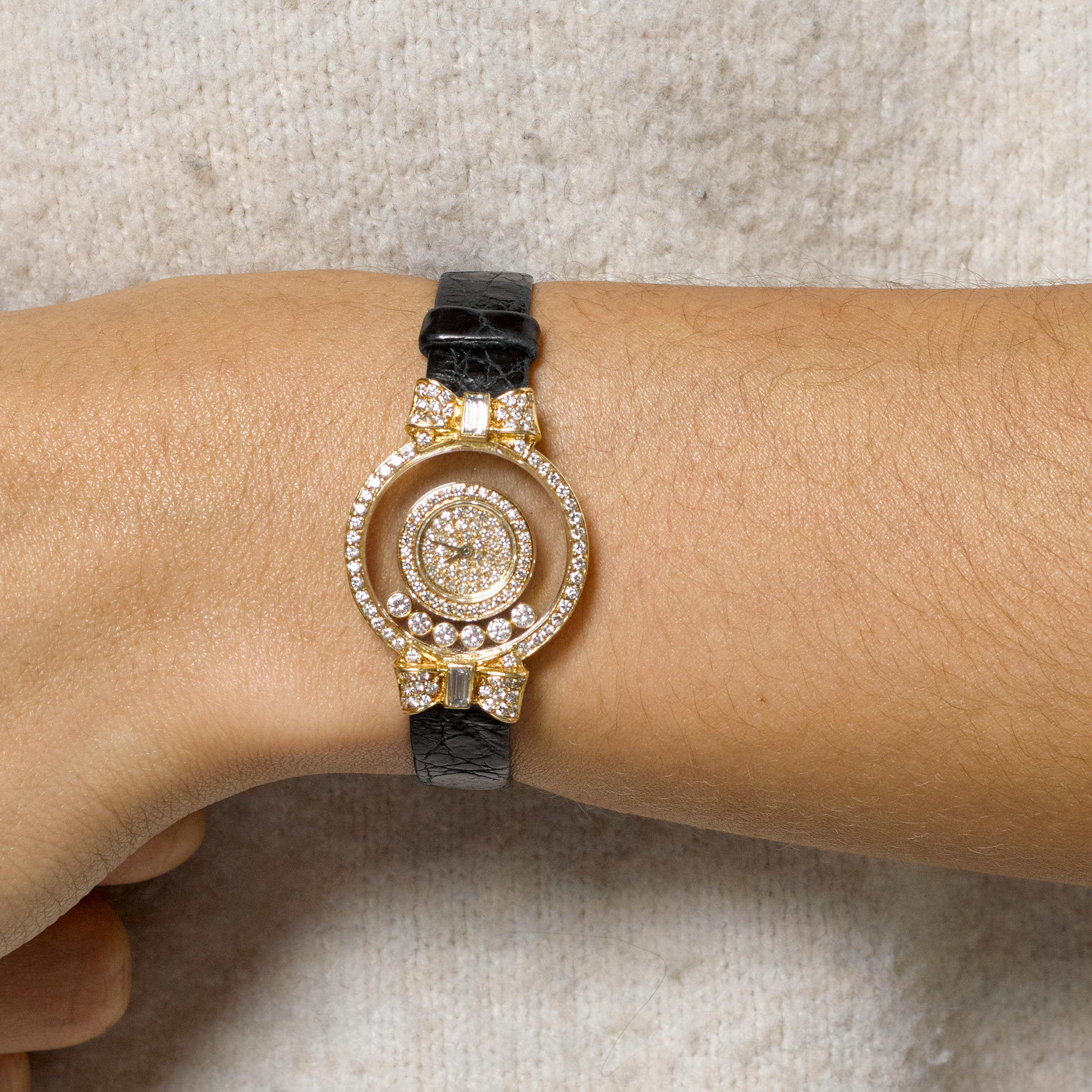 CHOPARD A LADY S 18K GOLD AND DIAMOND SET QUARTZ
