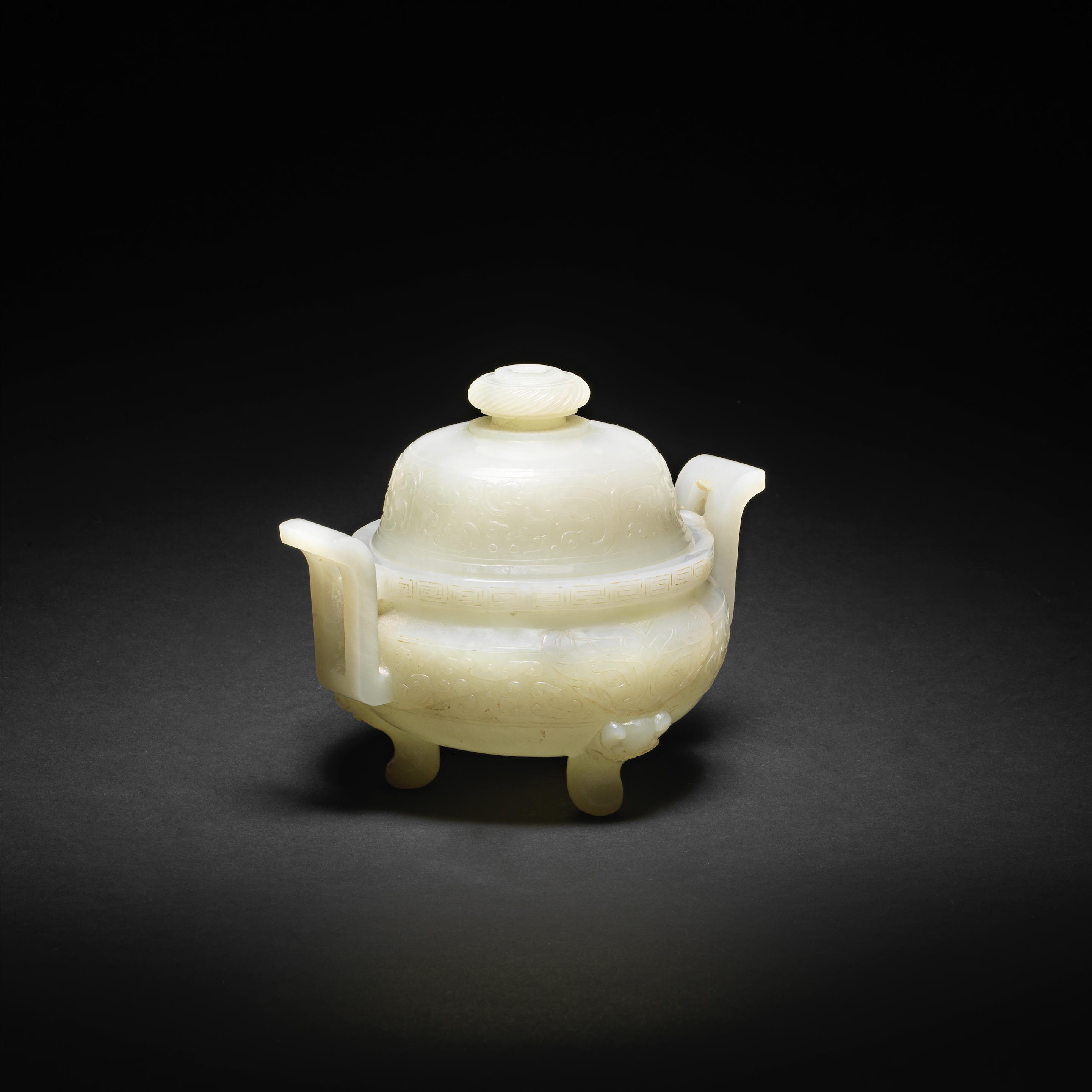A RARE ARCHAISTIC WHITE JADE TRIPOD INCENSE BURNER AND COVER