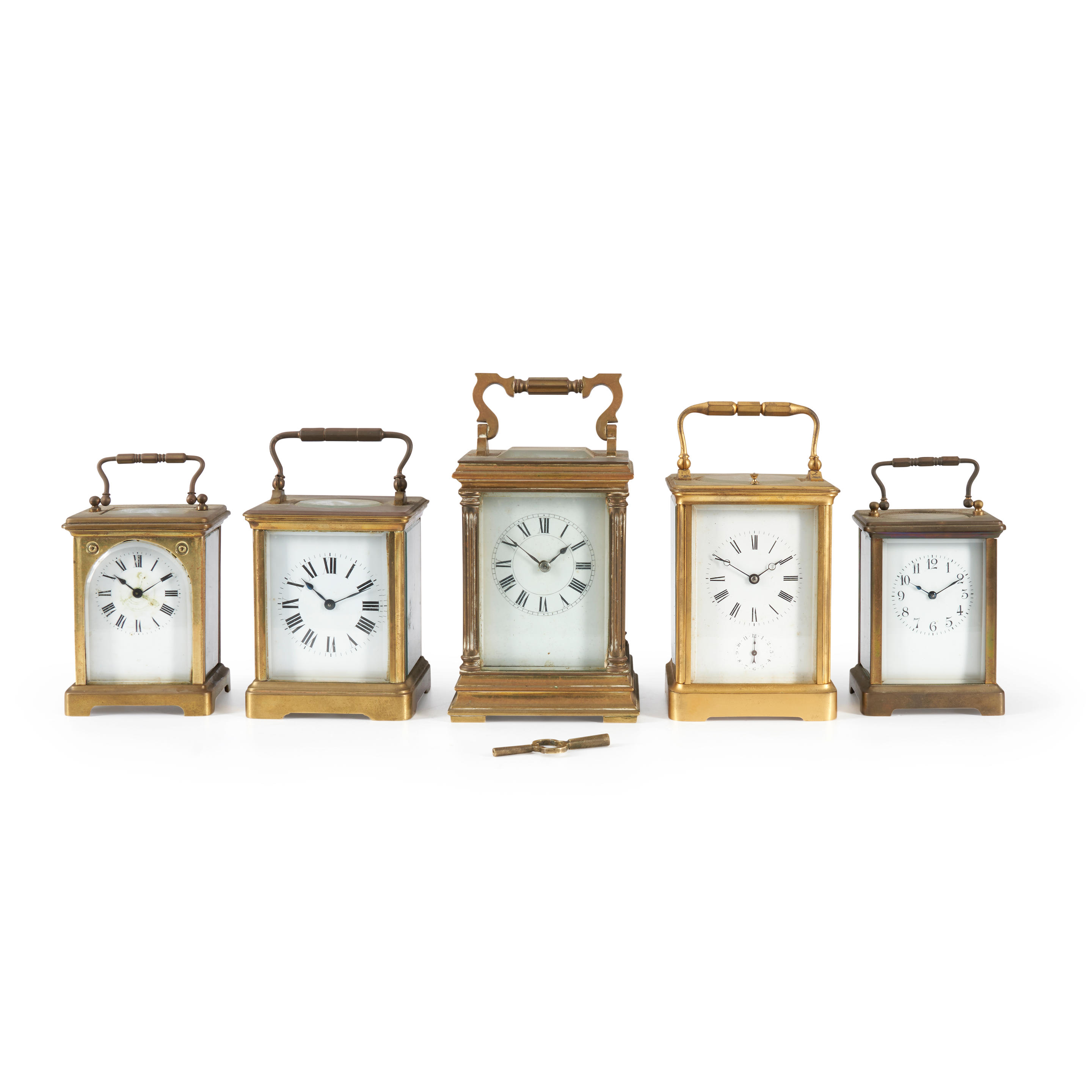 FIVE BRASS AND GLASS CARRIAGE TIMEPIECES France 19th century each