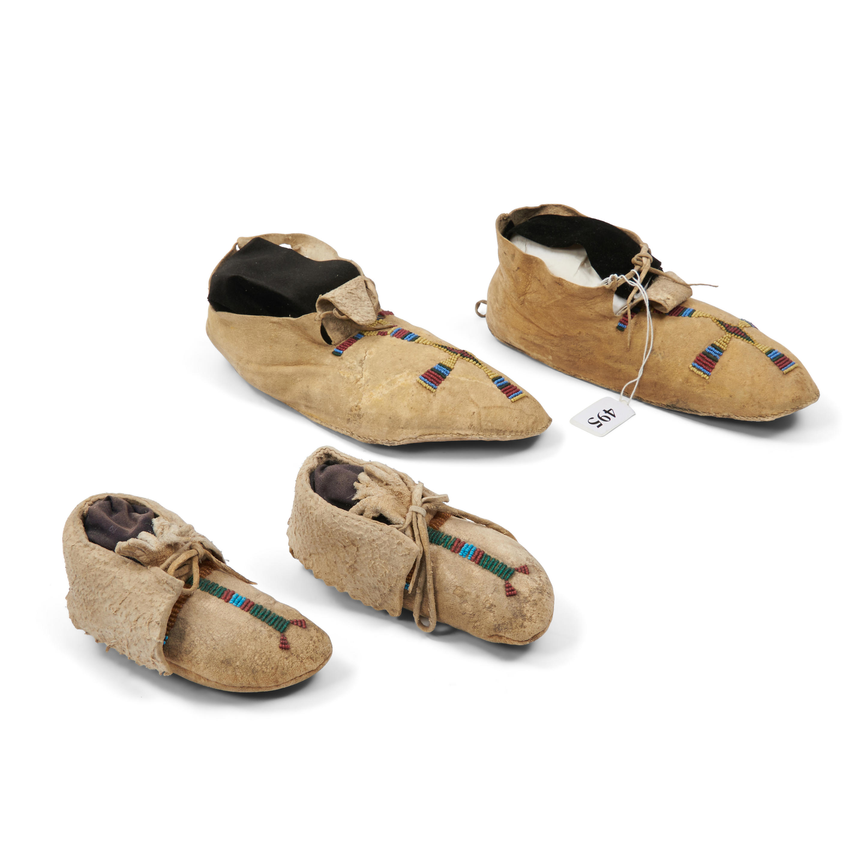 TWO PAIR OF PLAINS MOCCASINS Central and Northern Plains late