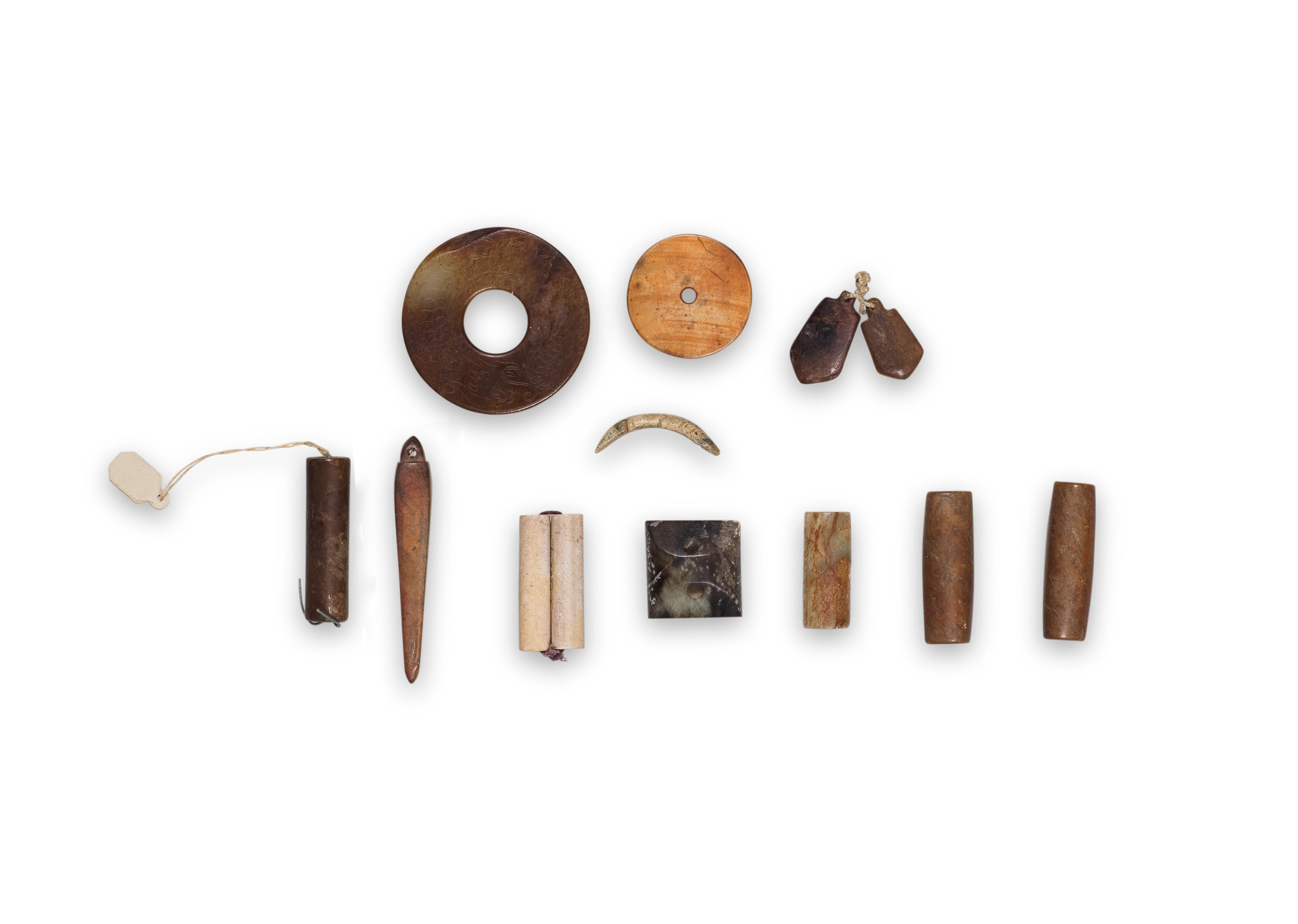A GROUP OF ELEVEN ARCHAIC JADE ORNAMENTS Neolithic Period to