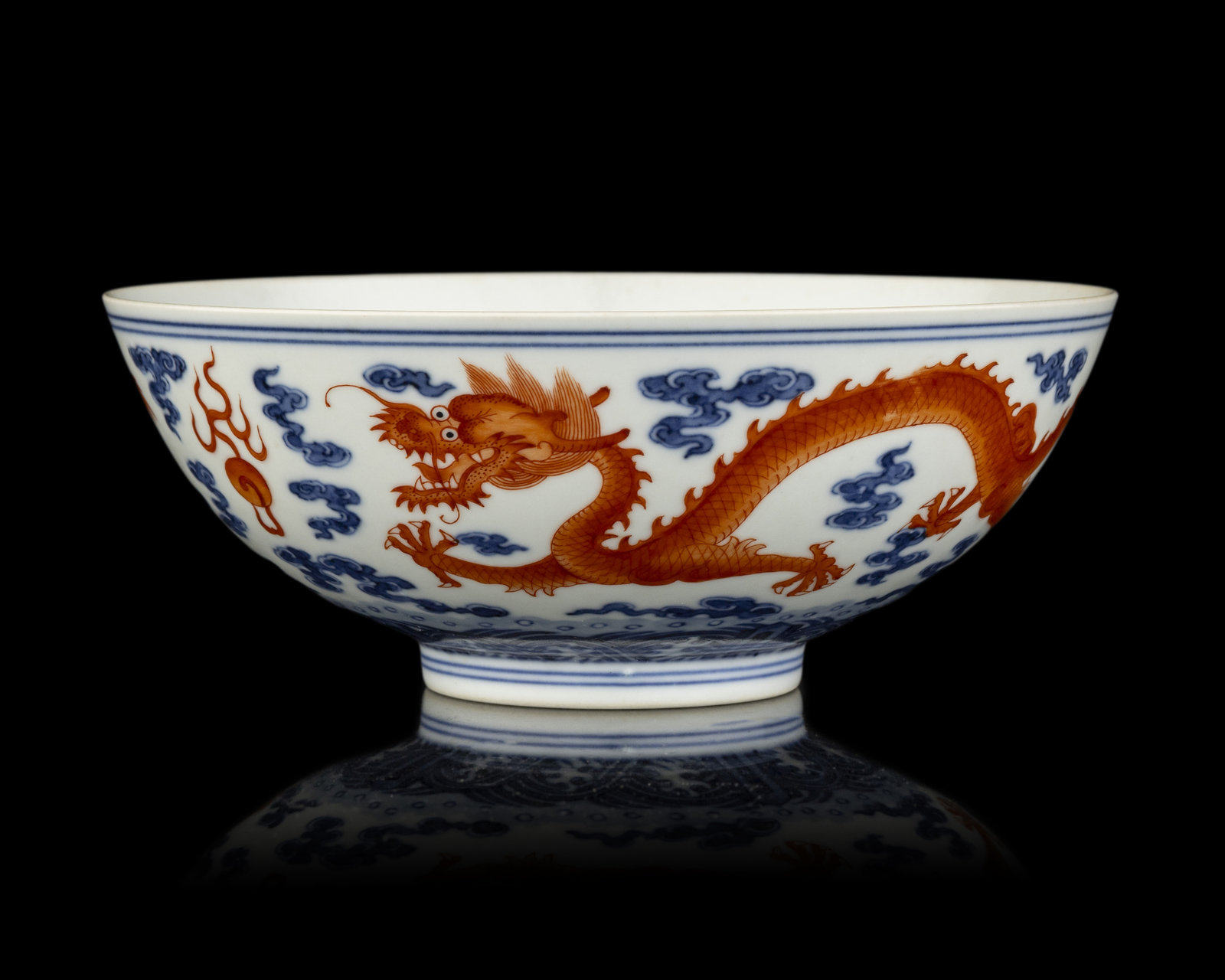 A Chinese Iron Red Decorated Underglaze Blue Porcelain Dragon Bowl