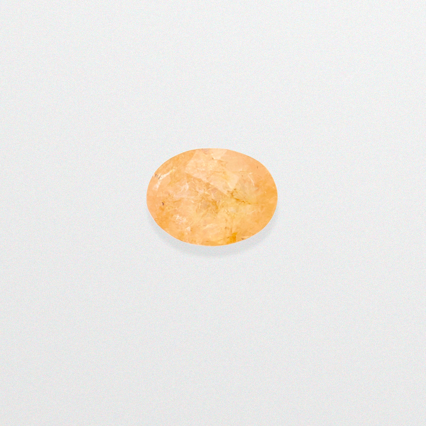 PADPARADSCHA TYPE SAPPHIRE An oval shaped checkerboard faceted fancy colored